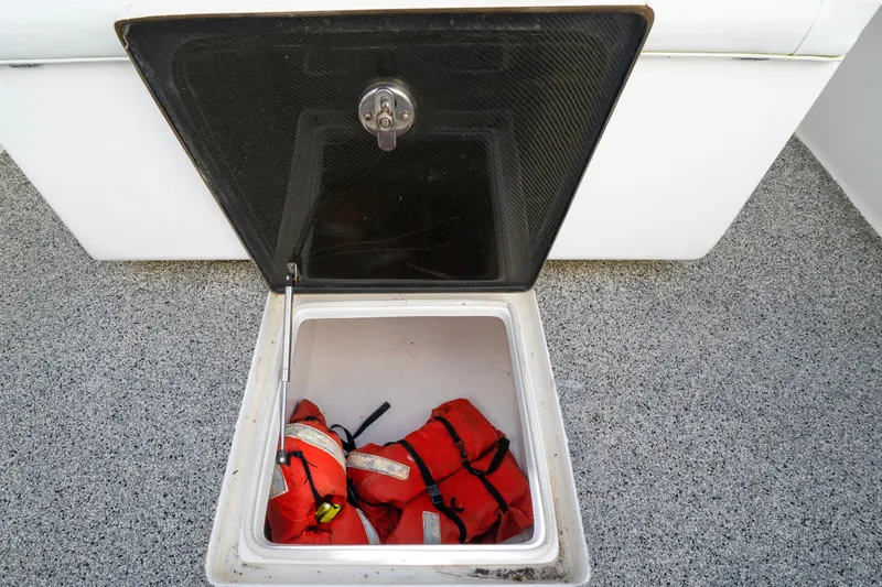 Hoo Hunter Yacht Photos Pics Open storage compartment on 2012 SeaHunter 37 Tournament boat with life jackets inside.