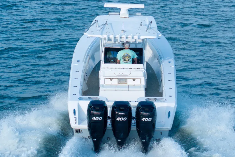 Hoo Hunter Yacht Photos Pics 2012 SeaHunter 37 Tournament boat with triple 400 horsepower engines cruising on water.