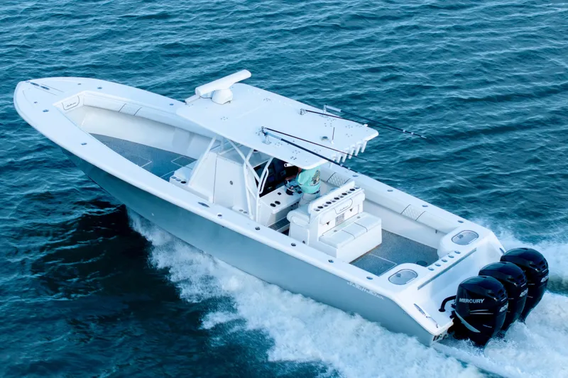 Hoo Hunter Yacht Photos Pics 2012 SeaHunter 37 Tournament boat cruising on open water with triple Mercury engines.