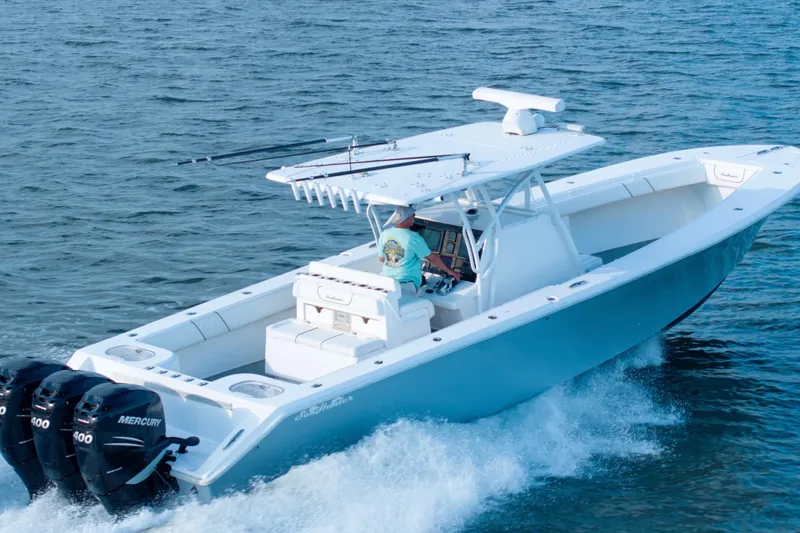 Hoo Hunter Yacht Photos Pics 2012 SeaHunter 37 Tournament boat cruising on open water with triple Mercury engines.