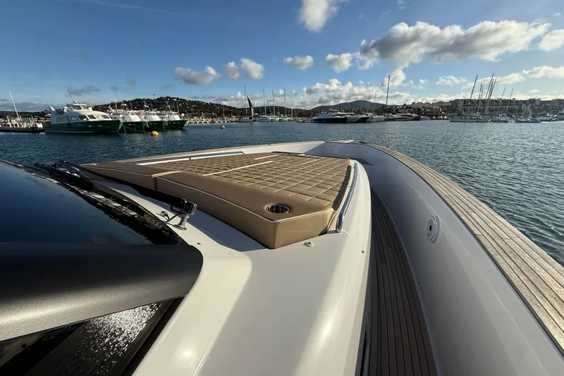 Five 3 Yacht Photos Pics 2024 Pardo Yachts 50 luxury yacht with sun deck, docked in a scenic marina.