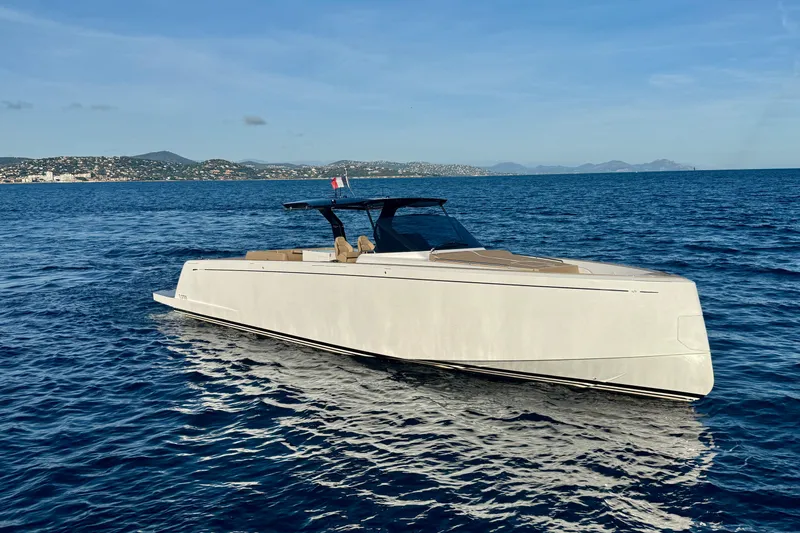 Five 3 Yacht Photos Pics 2024 Pardo Yachts 50 cruising on open sea with scenic coastal backdrop.