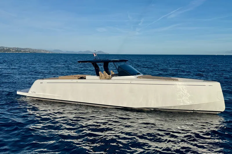 Five 3 Yacht Photos Pics 2024 Pardo Yachts 50 luxury yacht cruising on open sea under clear blue sky.