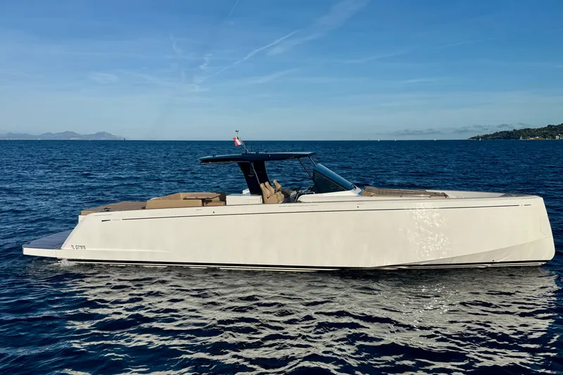 Five 3 Yacht Photos Pics 2024 Pardo Yachts 50 cruising on open water under clear blue skies.