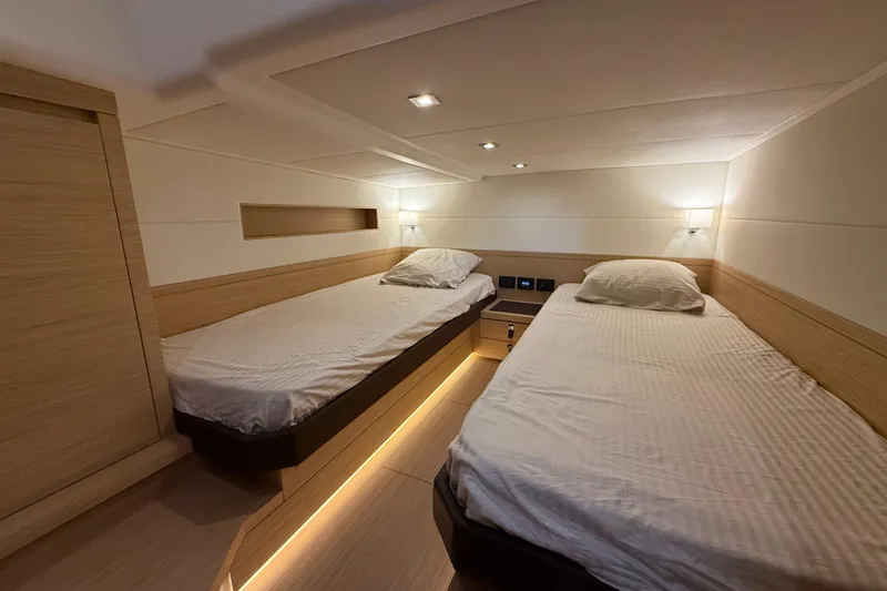 Five 3 Yacht Photos Pics Luxurious twin cabin interior of 2024 Pardo Yachts 50, featuring modern design and ambient lighting.