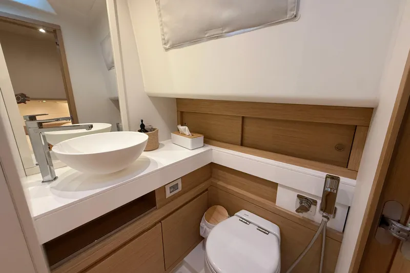 Five 3 Yacht Photos Pics Luxurious bathroom in 2024 Pardo Yachts 50, featuring modern sink and elegant wood accents.