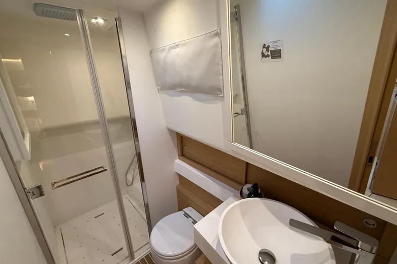 Five 3 Yacht Photos Pics Modern bathroom in 2024 Pardo Yachts 50, featuring sleek shower and elegant sink design.