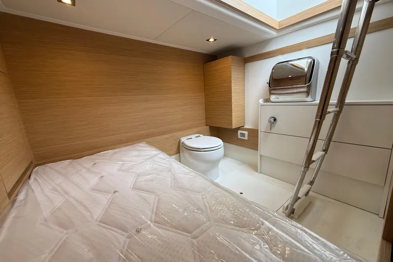 Five 3 Yacht Photos Pics 2024 Pardo Yachts 50 interior cabin with bed, toilet, and modern design.