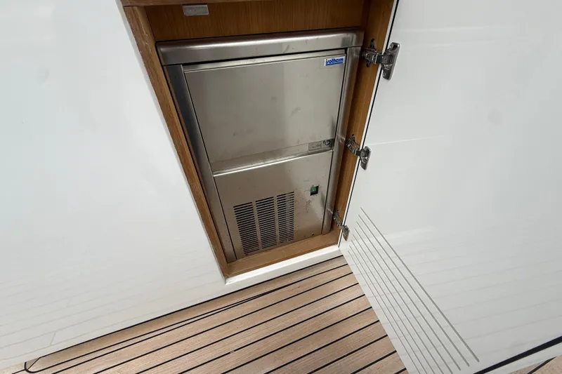 Five 3 Yacht Photos Pics Built-in refrigerator on 2024 Pardo Yachts 50, featuring sleek stainless steel design.