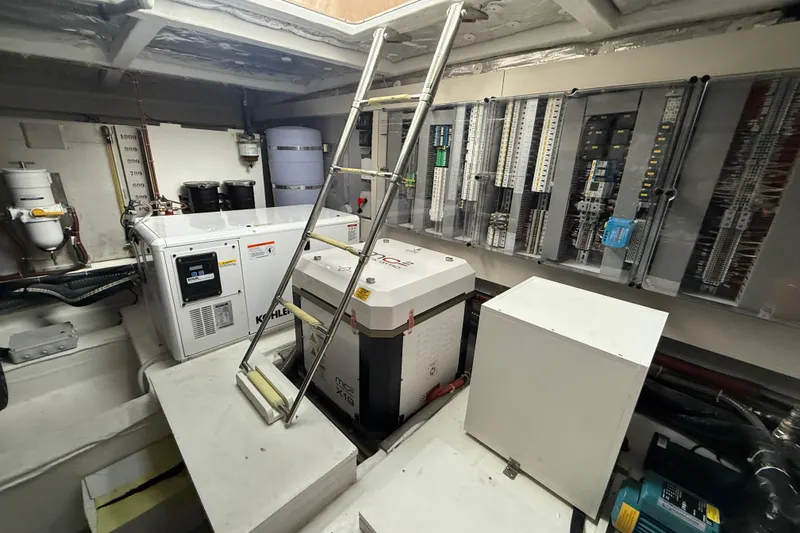 Five 3 Yacht Photos Pics Engine room of 2024 Pardo Yachts 50, featuring generators and electrical panels.