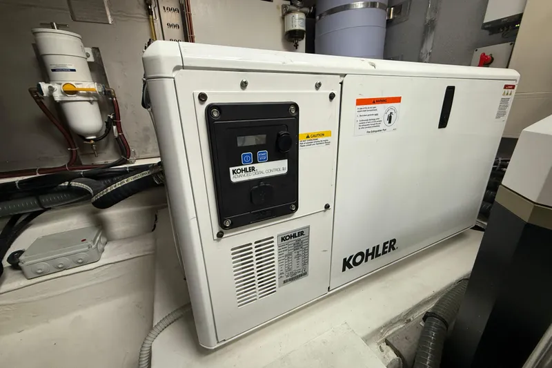 Five 3 Yacht Photos Pics Kohler generator in 2024 Pardo Yachts 50 engine room, showcasing advanced digital control.