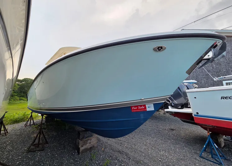  Yacht Photos Pics 2014 Pursuit C 280 Center Console boat for sale, displayed on stands.