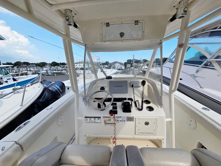  Yacht Photos Pics 2014 Pursuit C 280 Center Console boat interior with Garmin navigation system at marina.