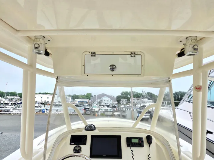  Yacht Photos Pics 2014 Pursuit C 280 Center Console boat helm with electronics, docked at marina.