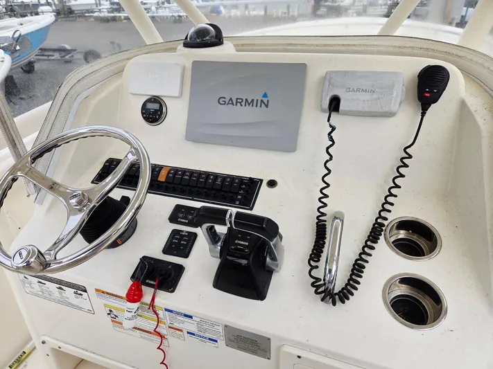  Yacht Photos Pics 2014 Pursuit C 280 Center Console helm with Garmin navigation and controls.