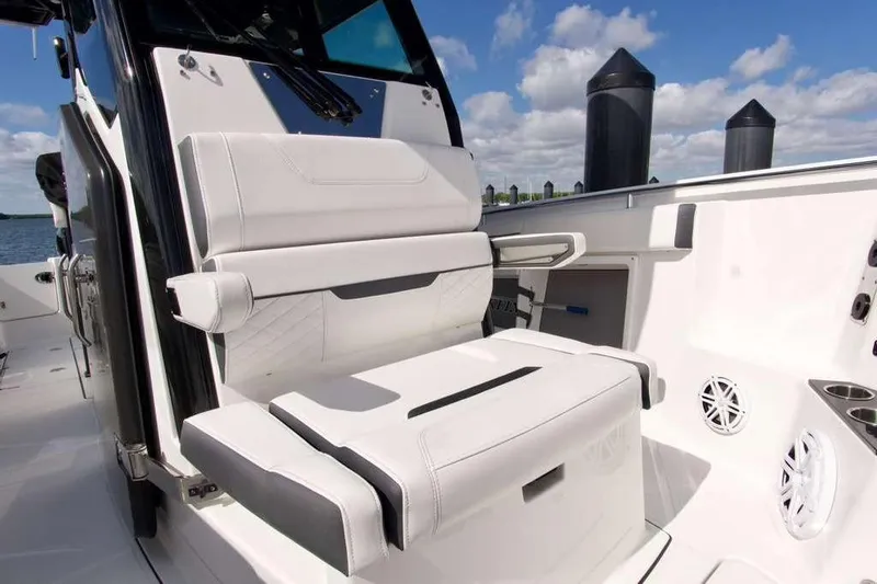  Yacht Photos Pics 2023 Blackfin 302 CC boat interior with white seating and modern design.