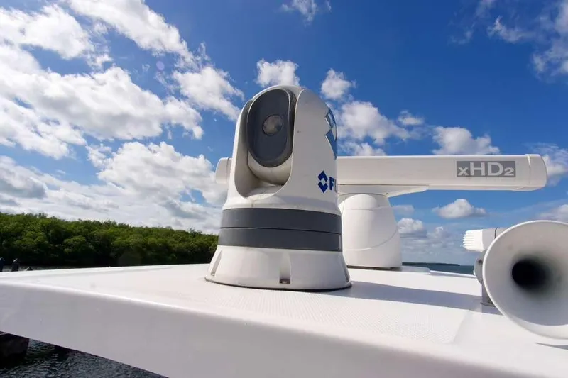  Yacht Photos Pics 2023 Blackfin 302 CC boat radar and camera system under a clear blue sky.