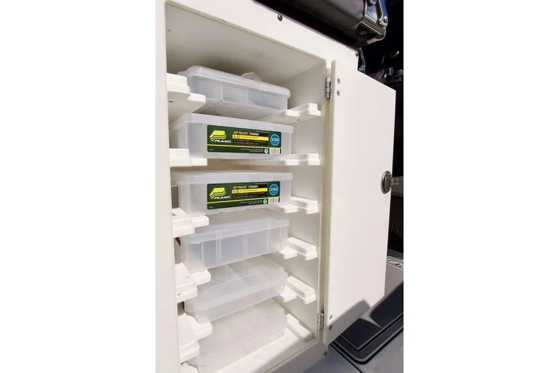  Yacht Photos Pics Storage cabinet with tackle boxes on a 2023 Blackfin 302 CC boat.