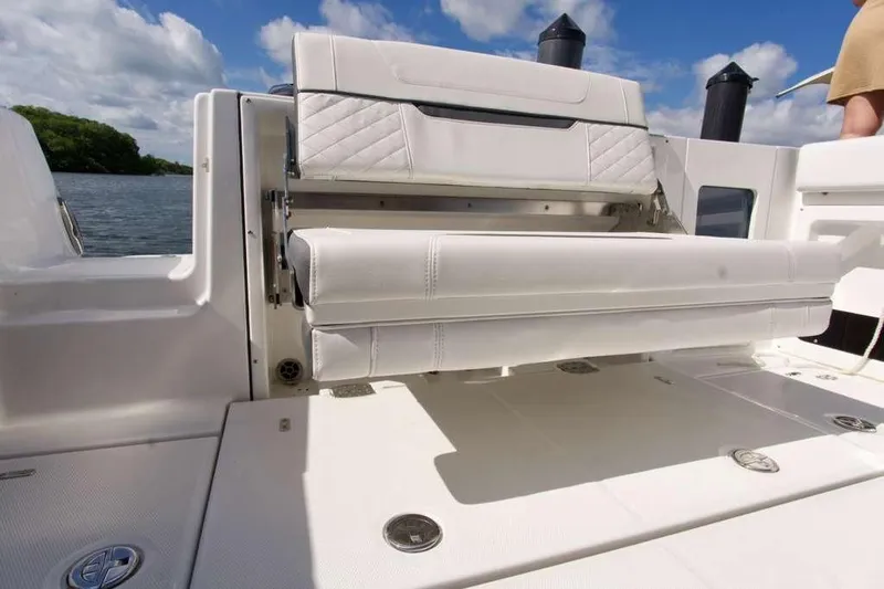  Yacht Photos Pics 2023 Blackfin 302 CC boat with white seating and open water view.
