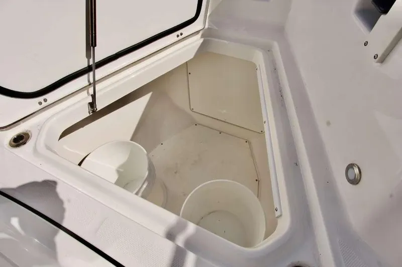  Yacht Photos Pics 2023 Blackfin 302 CC boat storage compartment with open hatch and buckets.