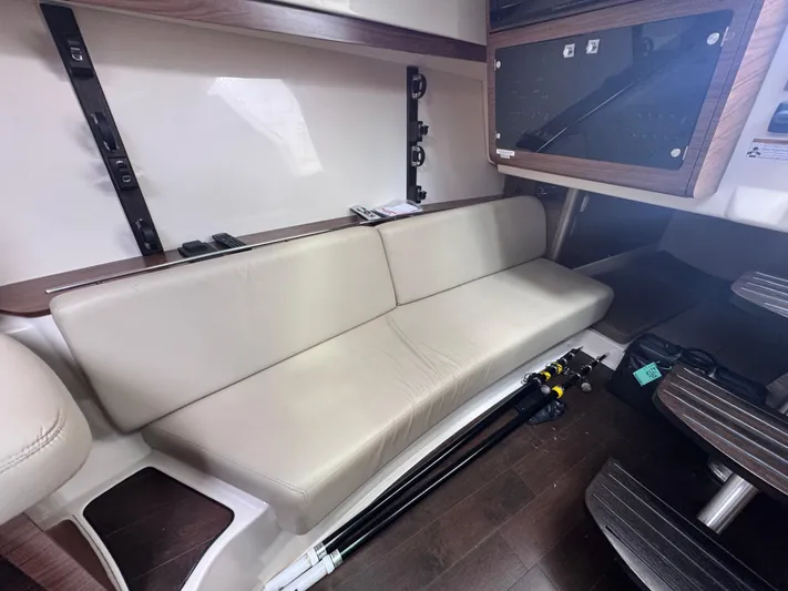  Yacht Photos Pics 2015 Boston Whaler 345 Conquest interior with beige seating and wood accents.
