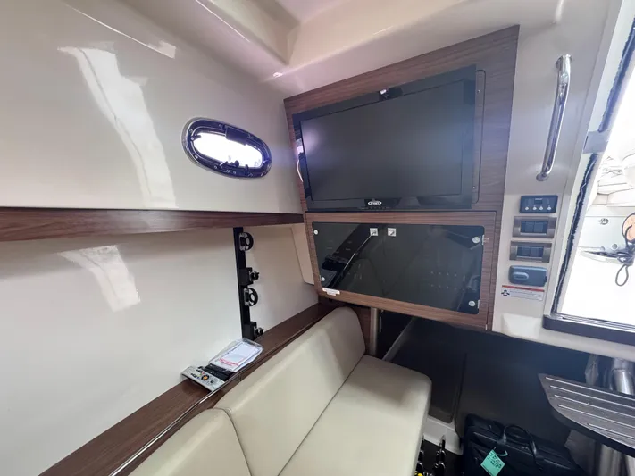  Yacht Photos Pics Interior of 2015 Boston Whaler 345 Conquest with TV and seating area.