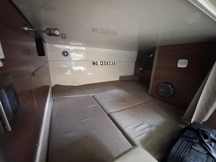  Yacht Photos Pics Interior cabin of 2015 Boston Whaler 345 Conquest, featuring cozy sleeping area.