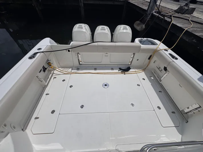 Yacht Photos Pics 2015 Boston Whaler 345 Conquest boat deck with triple outboard engines.