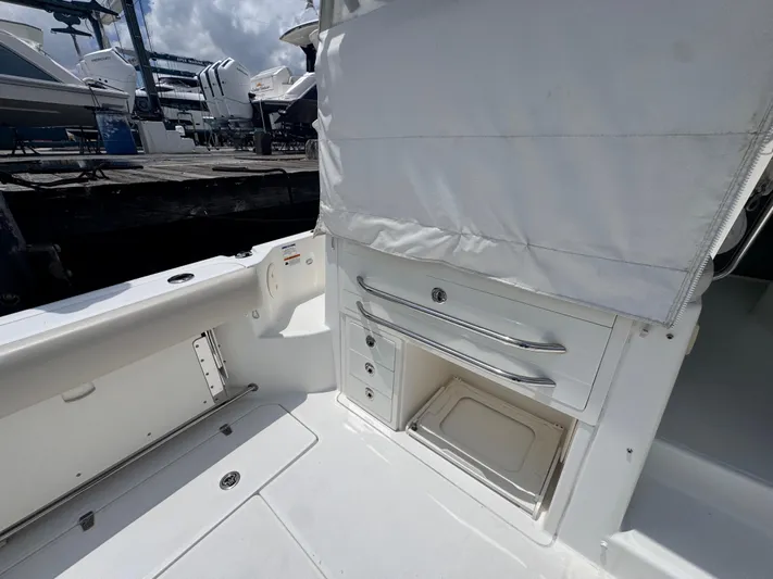  Yacht Photos Pics 2015 Boston Whaler 345 Conquest interior with storage compartments and seating area.