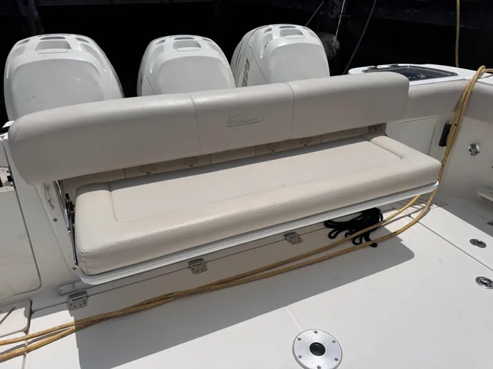  Yacht Photos Pics 2015 Boston Whaler 345 Conquest boat with foldable bench seat and triple outboard engines.