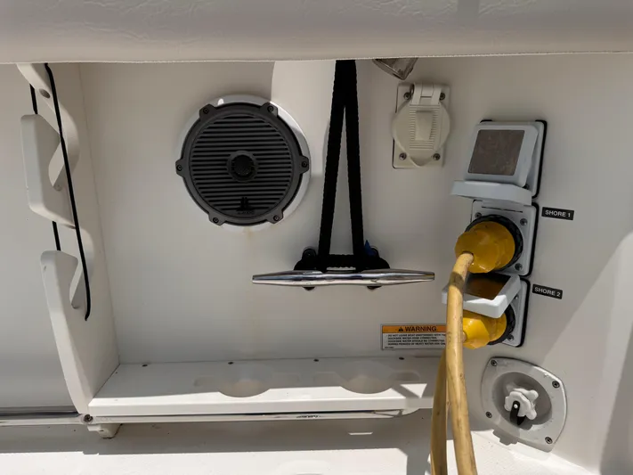  Yacht Photos Pics 2015 Boston Whaler 345 Conquest boat electrical panel with speaker and power cords.