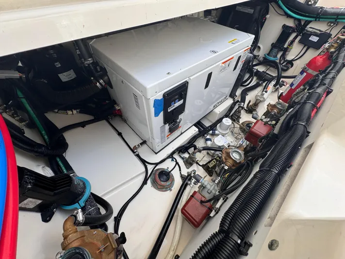  Yacht Photos Pics Engine compartment of a 2015 Boston Whaler 345 Conquest with various mechanical components.