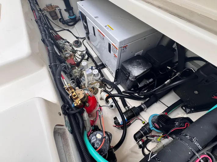  Yacht Photos Pics Engine compartment of a 2015 Boston Whaler 345 Conquest, showcasing wiring and components.