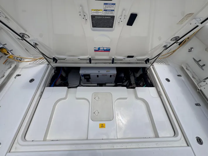  Yacht Photos Pics 2015 Boston Whaler 345 Conquest engine compartment, open hatch view.