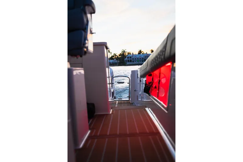 Let&rsquo;s Go Yacht Photos Pics 2025 Regal 38 SAV boat interior with sunset view over water.