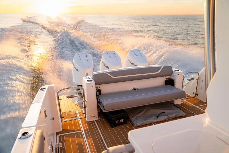 Let&rsquo;s Go Yacht Photos Pics 2025 Regal 38 SAV boat cruising at sunset with powerful engines and sleek design.