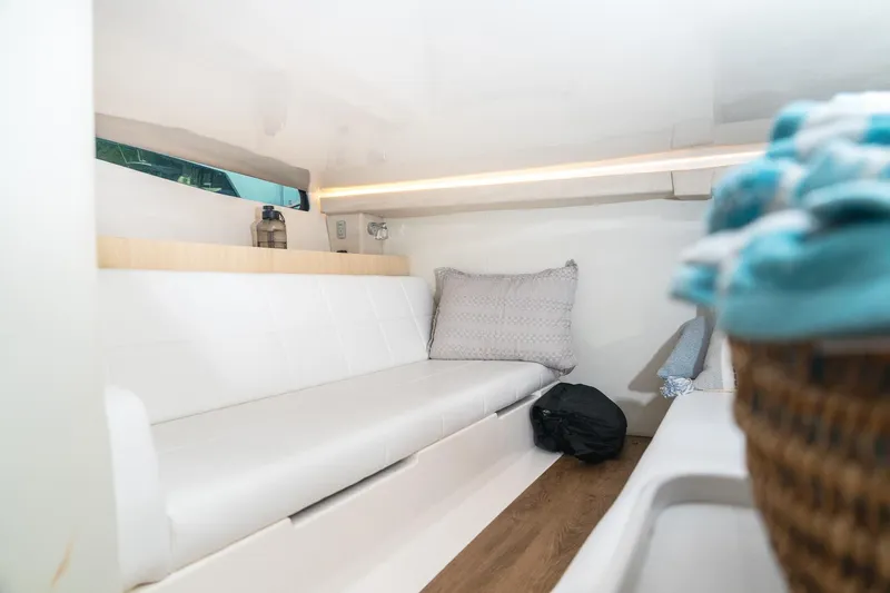 Let&rsquo;s Go Yacht Photos Pics Interior of 2025 Regal 38 SAV boat with white seating and cozy decor.