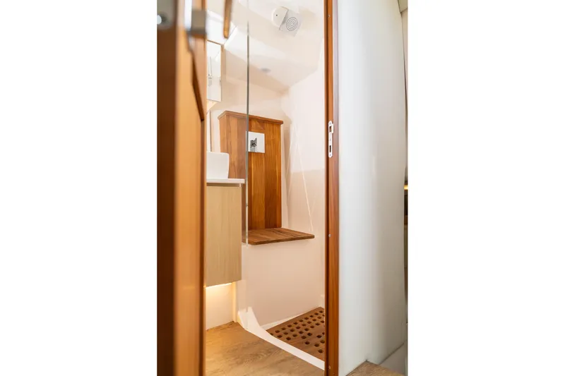 Let&rsquo;s Go Yacht Photos Pics 2025 Regal 38 SAV yacht bathroom with wooden accents and modern fixtures.