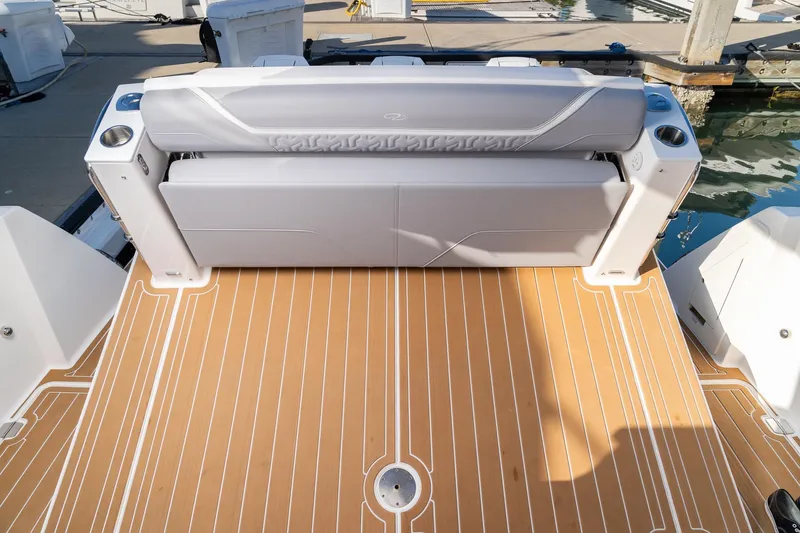 Let&rsquo;s Go Yacht Photos Pics 2025 Regal 38 SAV boat with sleek seating and teak-style deck.