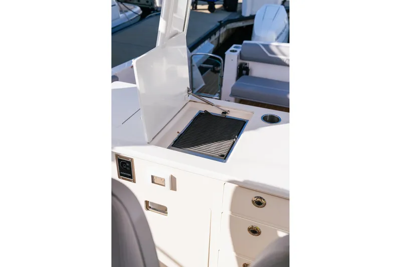 Let&rsquo;s Go Yacht Photos Pics 2025 Regal 38 SAV boat grill station with open lid and storage drawers.