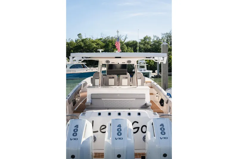 Let&rsquo;s Go Yacht Photos Pics 2025 Regal 38 SAV boat with triple Mercury 400 V10 engines, docked in a marina.