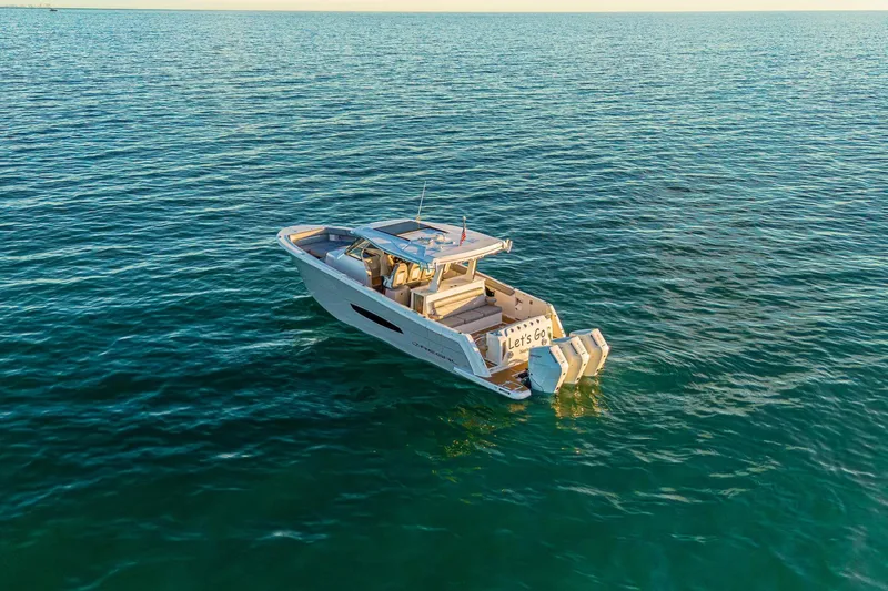 Let&rsquo;s Go Yacht Photos Pics 2025 Regal 38 SAV boat cruising on open water, showcasing sleek design and powerful engines.