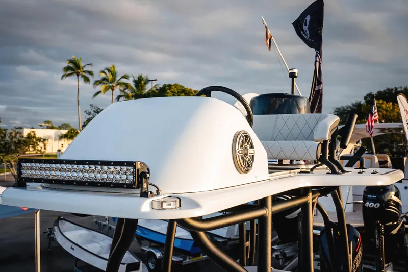  Yacht Photos Pics 2026 Barker Boatworks 26 Open with sleek design and advanced features, docked under palm trees.