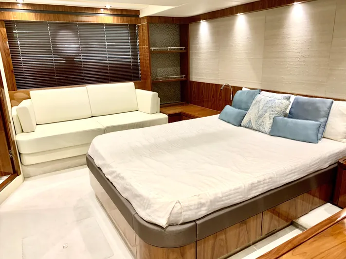  Yacht Photos Pics Luxurious bedroom interior of 2016 Sunseeker Manhattan 65 yacht with bed and sofa.