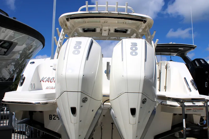 Yacht Photos Pics 2021 Boston Whaler 320 Vantage with dual 300 horsepower engines, docked under a clear blue sky.