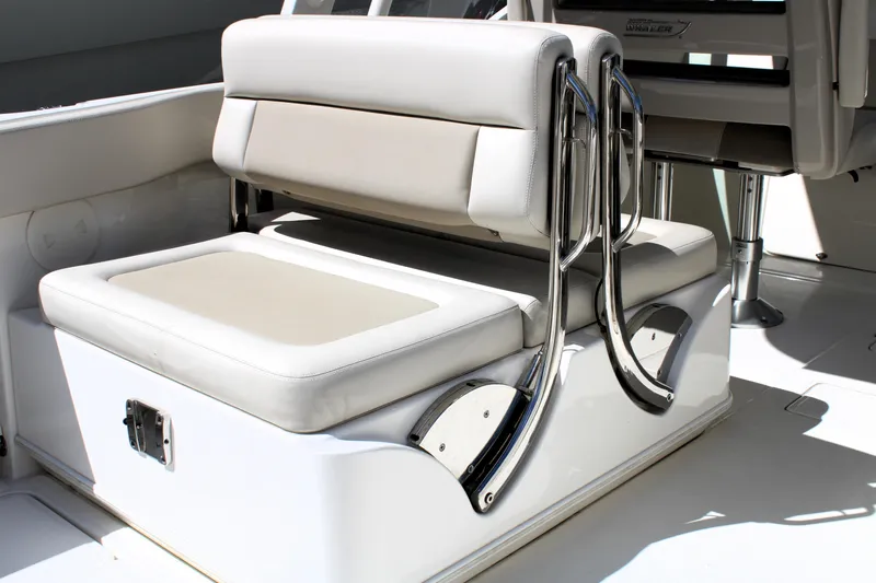  Yacht Photos Pics 2021 Boston Whaler 320 Vantage boat seating with chrome accents and cushioned upholstery.