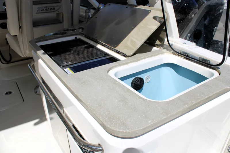  Yacht Photos Pics 2021 Boston Whaler 320 Vantage boat interior with sink and grill station.