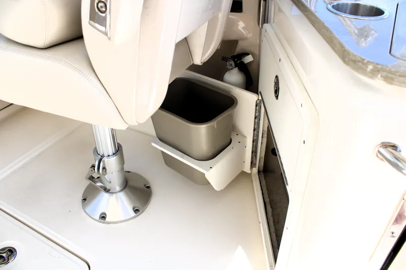  Yacht Photos Pics 2021 Boston Whaler 320 Vantage interior with storage compartment and seat base.