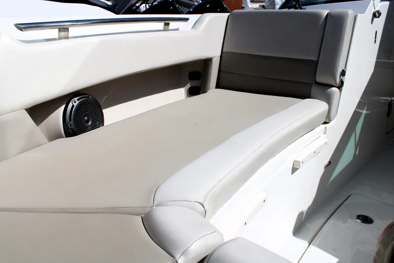  Yacht Photos Pics 2021 Boston Whaler 320 Vantage interior seating with speaker, showcasing luxury and comfort.