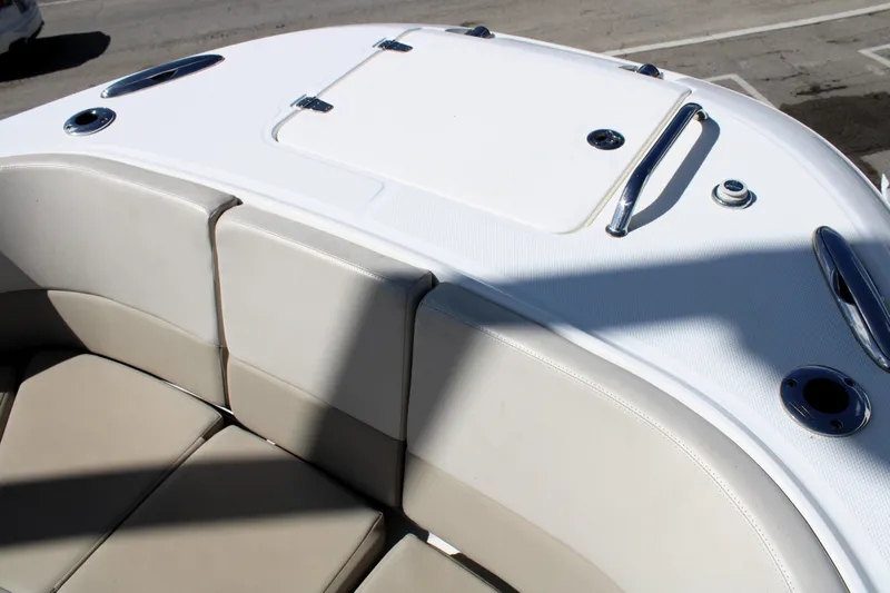  Yacht Photos Pics 2021 Boston Whaler 320 Vantage boat seating area with storage compartment.